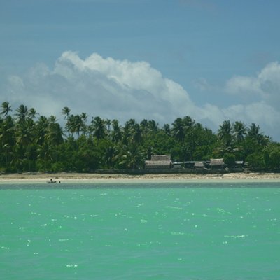 Looking from the lagoon across at homes on Abaiang Island, a low-lying coral atoll in Kiribati. (Credit: Karen McNamara)